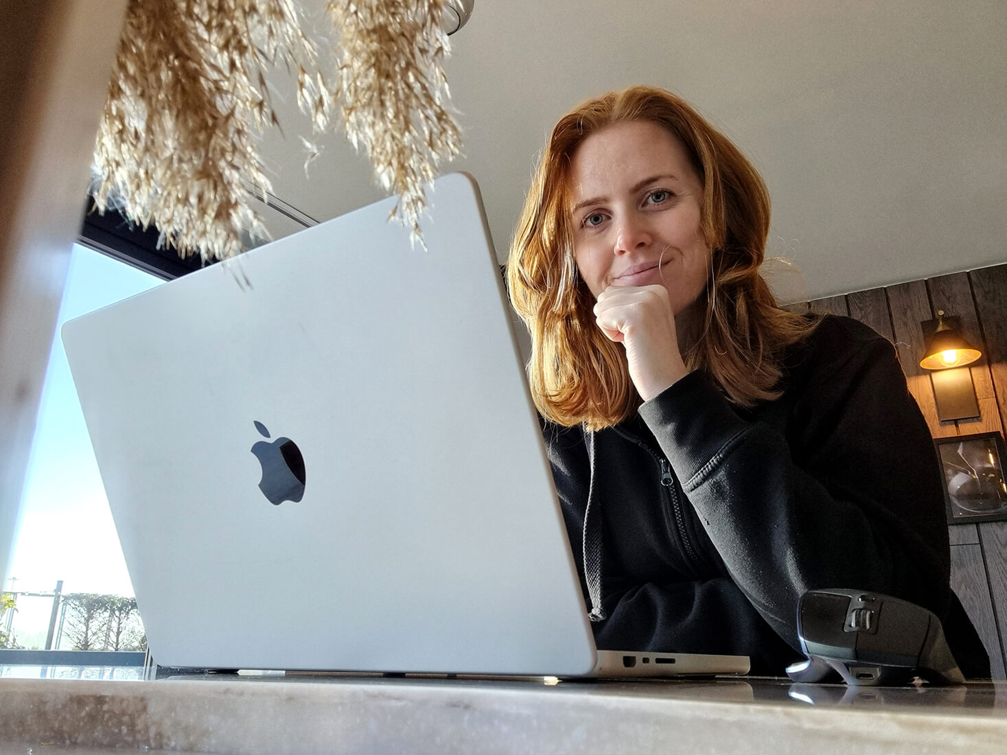 Healthy Pixels founder Monika on a laptop.