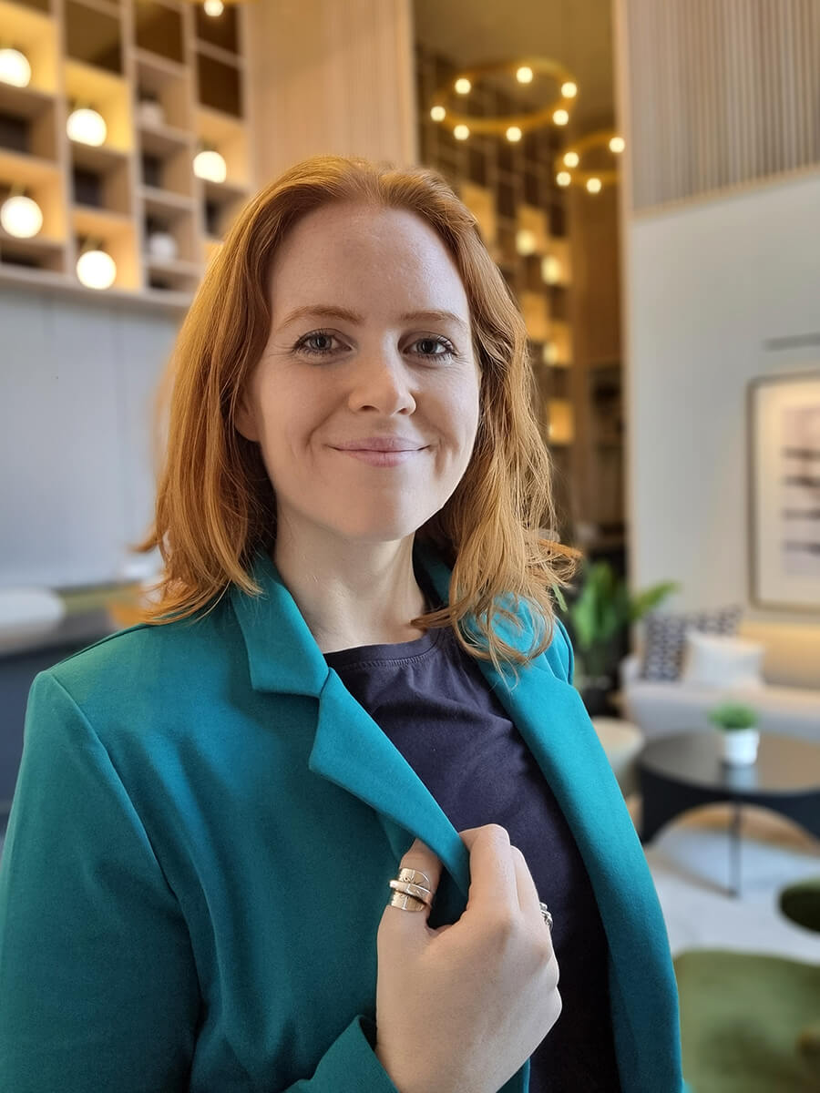 Healthy Pixels founder Monika in a blue blazer.